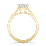 Princess cut lab grown diamond solitaire ring with yellow gold band and prong setting, elegant design.