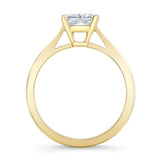 Princess cut lab grown diamond solitaire ring with yellow gold band and prong setting, elegant design.