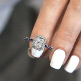 1 Carat Radiant Moissanite Halo Engagement Ring With Blue Sapphires