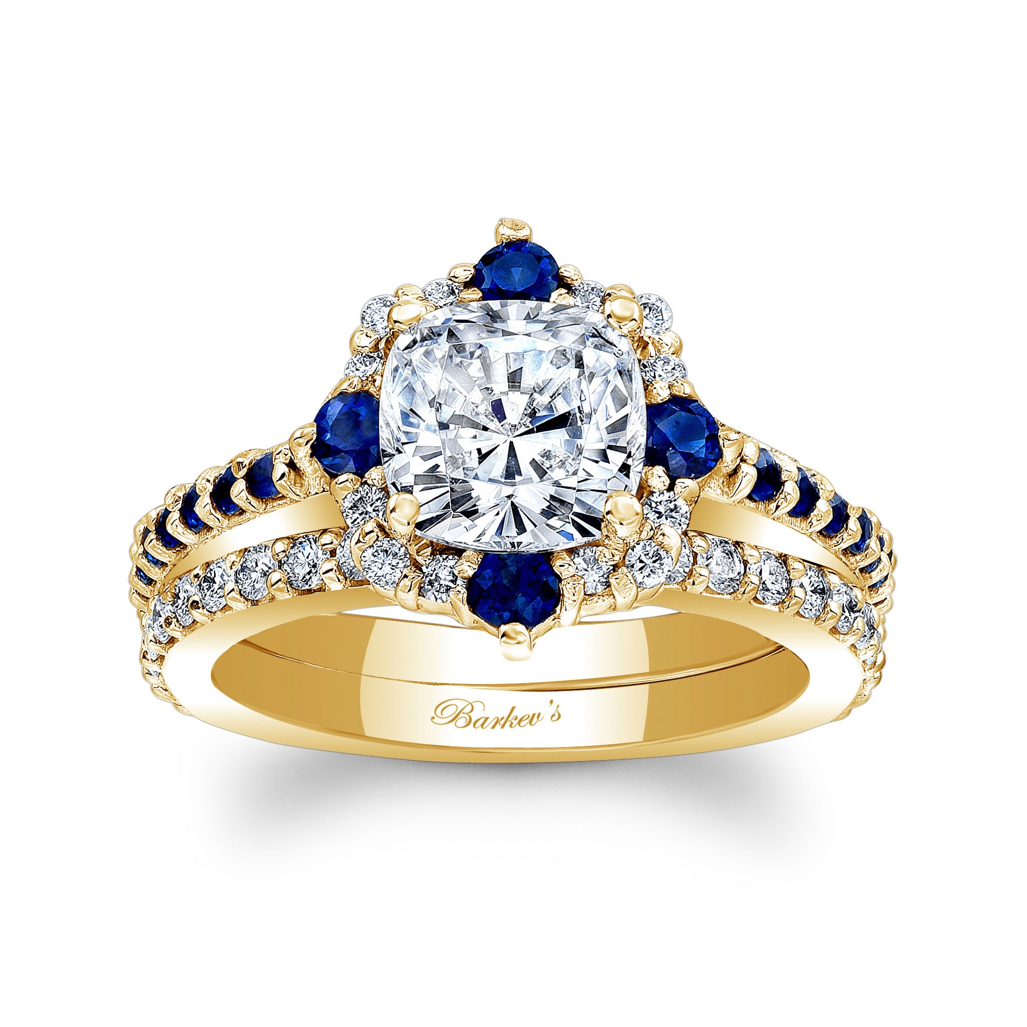 Gold ring with diamond and blue gemstones on a white background