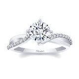 Twisted engagement ring with a round center stone and sparkling accent diamonds on a sleek band.