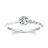 Olivia unique diamond promise ring in white gold featuring a round center diamond and delicate shared prong side diamonds.