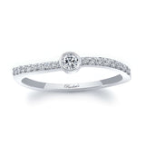 Ava Curved Diamond Promise Ring featuring a bezel set round diamond and sparkling side stones on a sleek band.