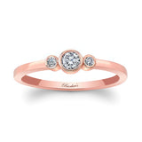 Sophia Three Stone Promise Ring in rose gold featuring a bezel set diamond center and two accent diamonds.