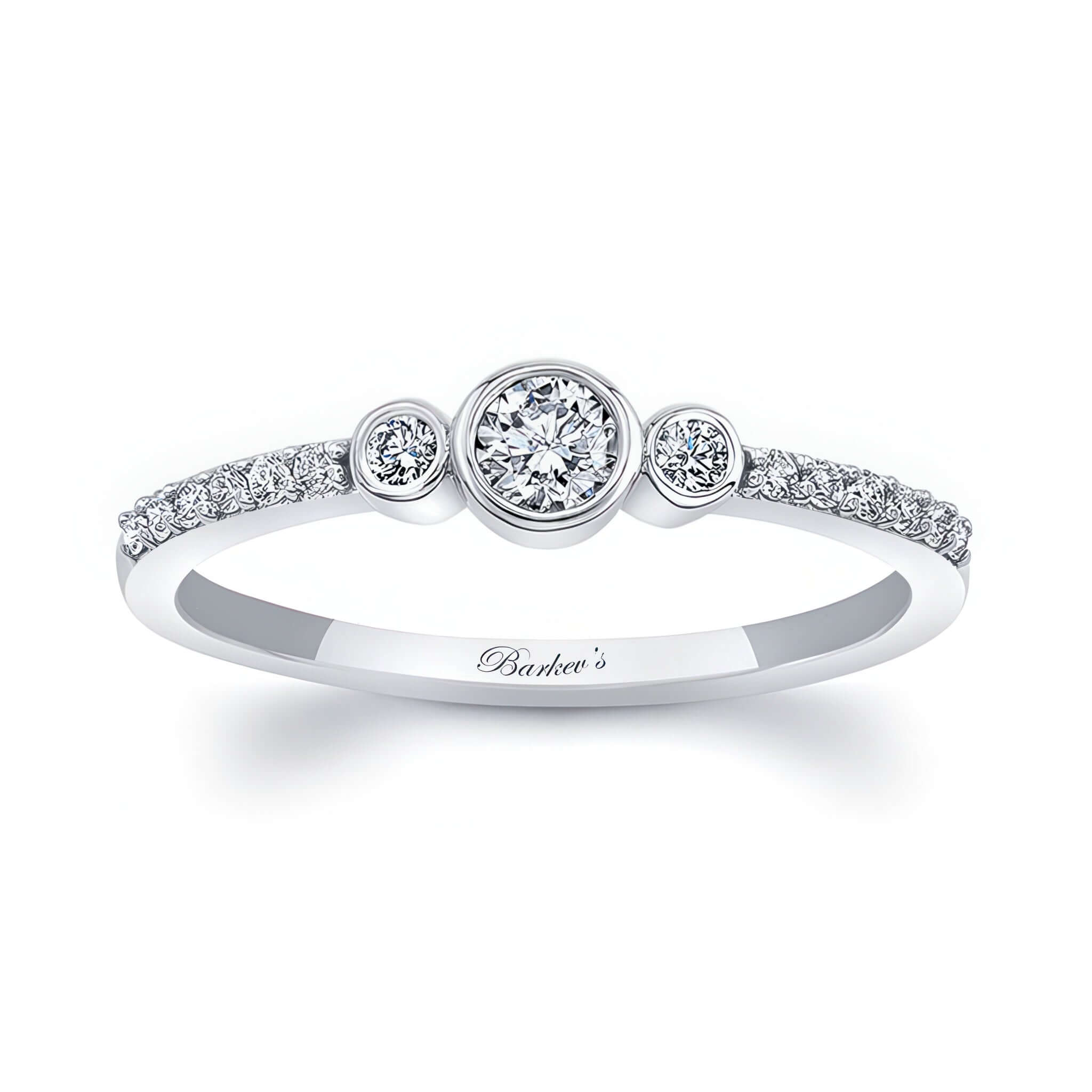 Mia three stone diamond promise ring with bezel set center and shared prong diamonds on a sleek white gold band.