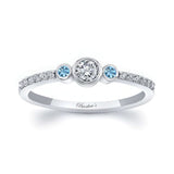 Mia Three Stone Aquamarine Accent Diamond Promise Ring featuring a center diamond and side aquamarine gemstones.