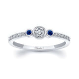 Mia three stone blue sapphire accent diamond promise ring with center diamond and sapphire side stones.