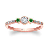 Mia Three Stone Emerald Accent Diamond Promise Ring with bezel set diamond and emerald gemstones.