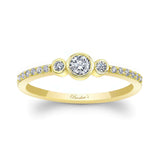 Mia Three Stone Diamond Promise Ring with center bezel set diamond and shared prong set accents in yellow gold.