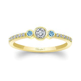 Mia three stone aquamarine accent diamond promise ring in yellow gold with intricate detailing.