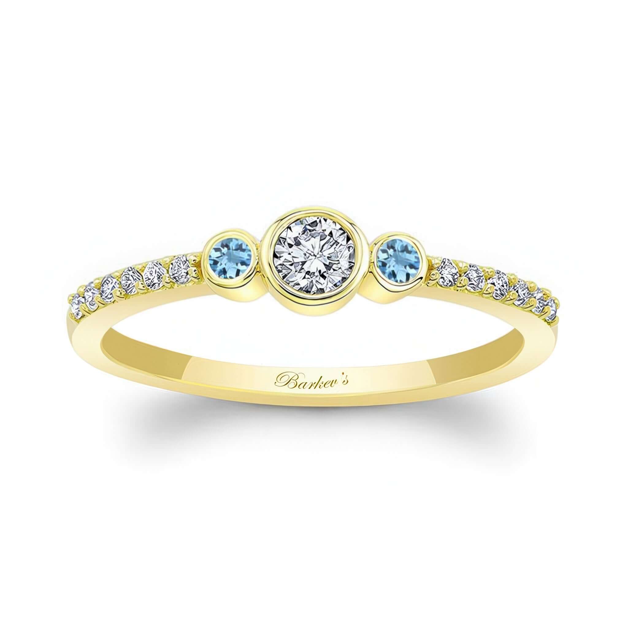 Mia three stone aquamarine accent diamond promise ring in yellow gold with intricate detailing.