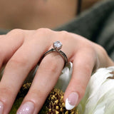 Pear Shaped Moissanite Black Diamond Accent Ring With Twisted Band