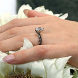 Pear Shaped Black Diamond Accent Ring With Twisted Band