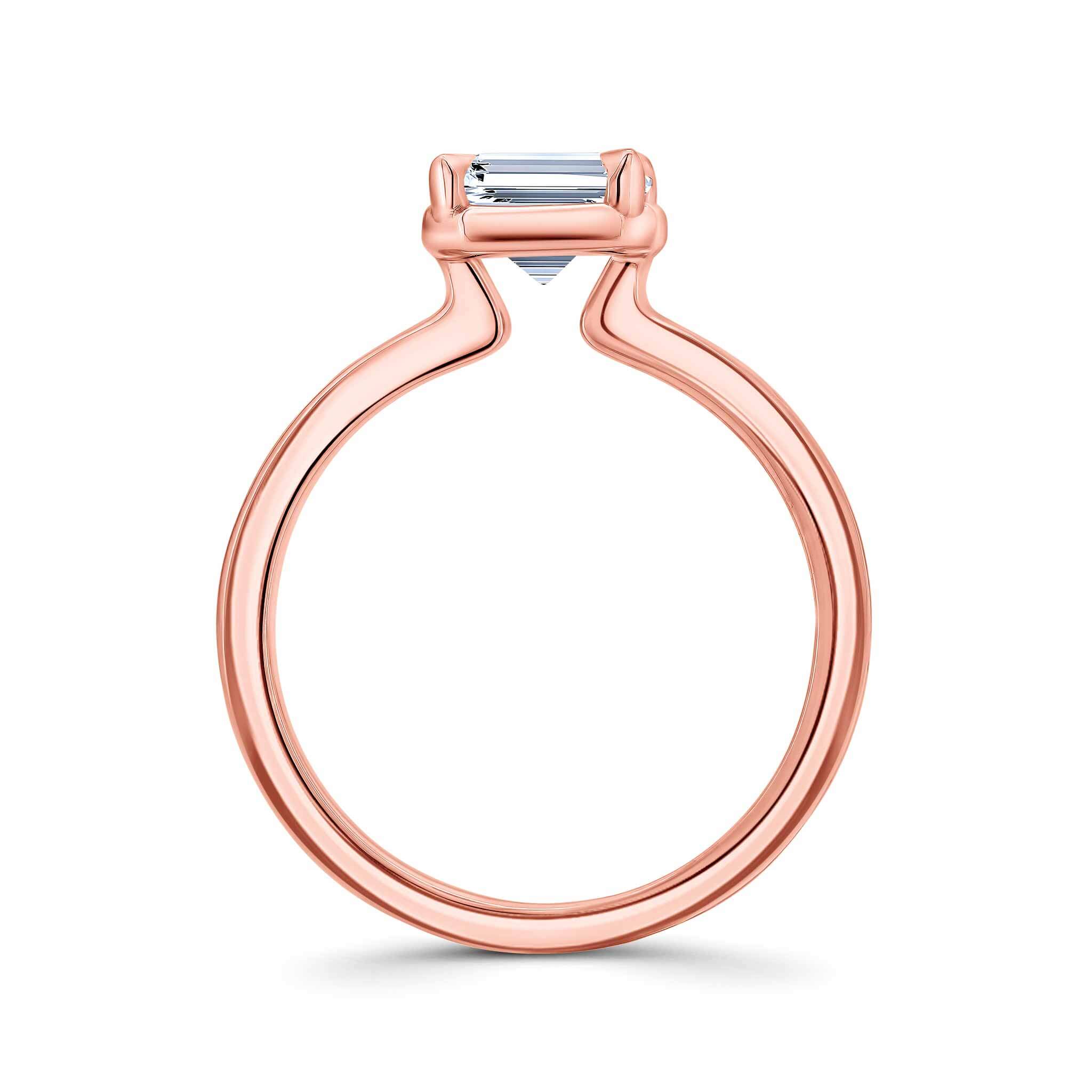 Elegant double band 2 carat emerald cut diamond solitaire ring in rose gold.