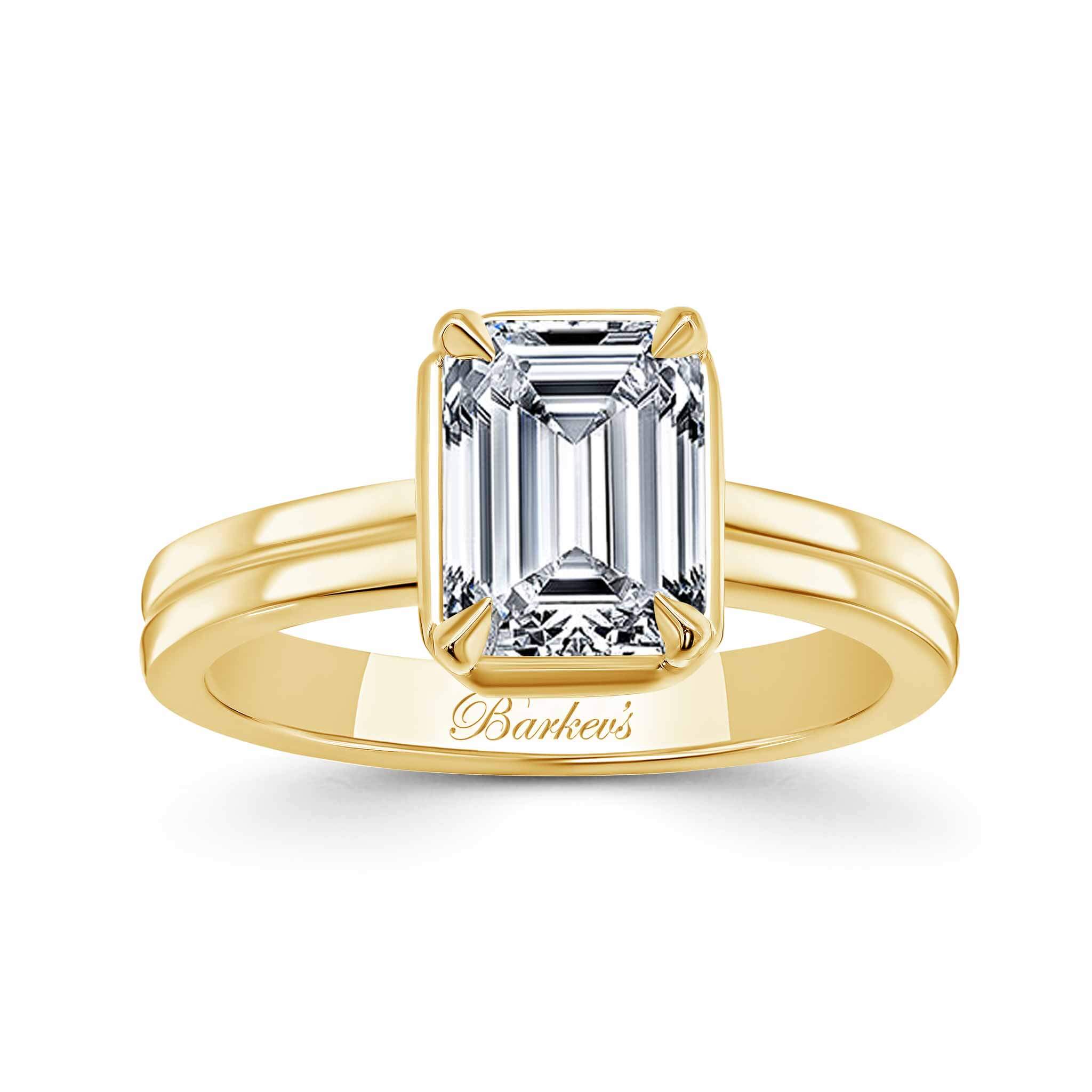Double Band 2 Carat Emerald Cut Diamond Solitaire Ring in yellow gold showcasing elegance and brilliance.