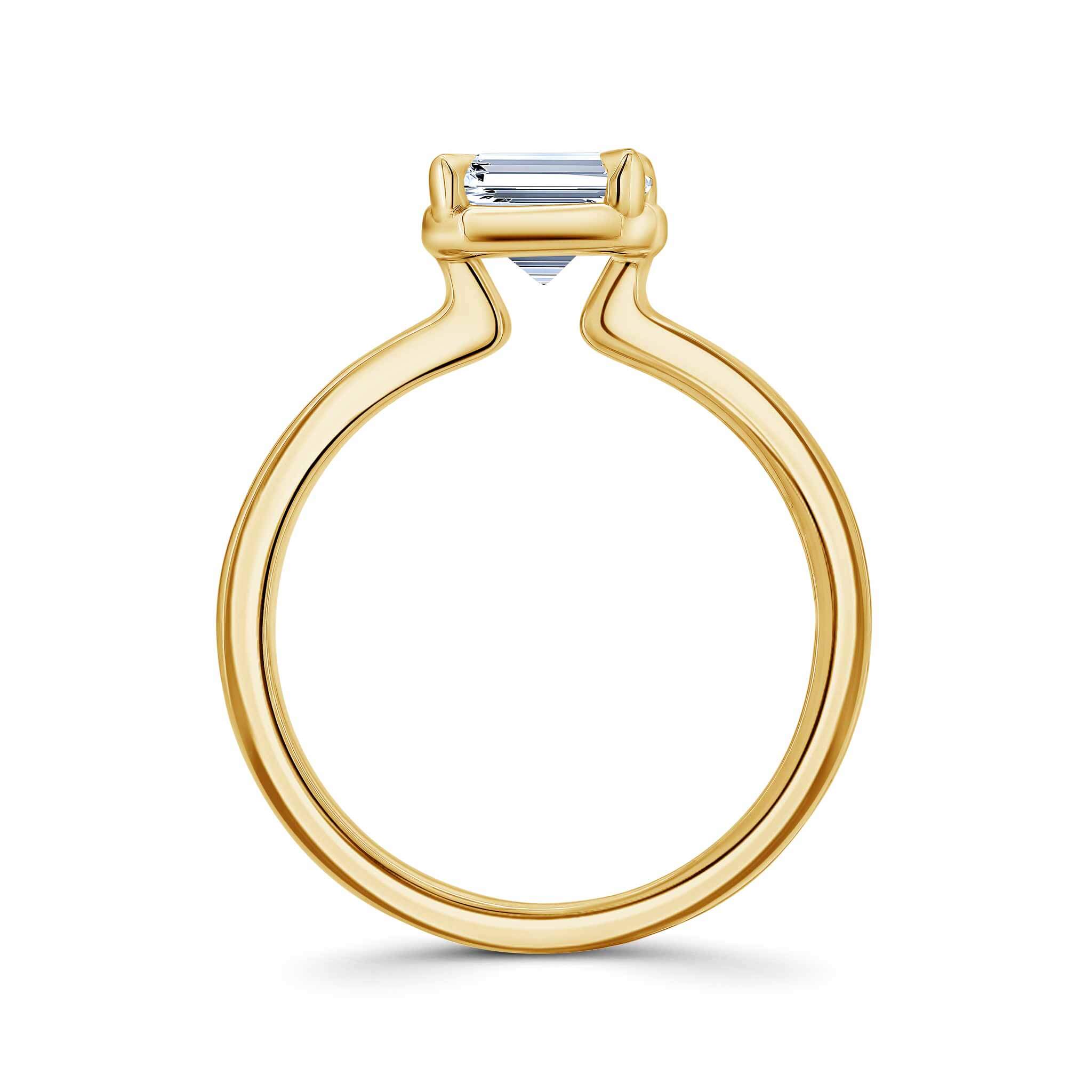 Double band 2 carat emerald cut diamond solitaire ring in gold, showcasing elegant design and brilliance.