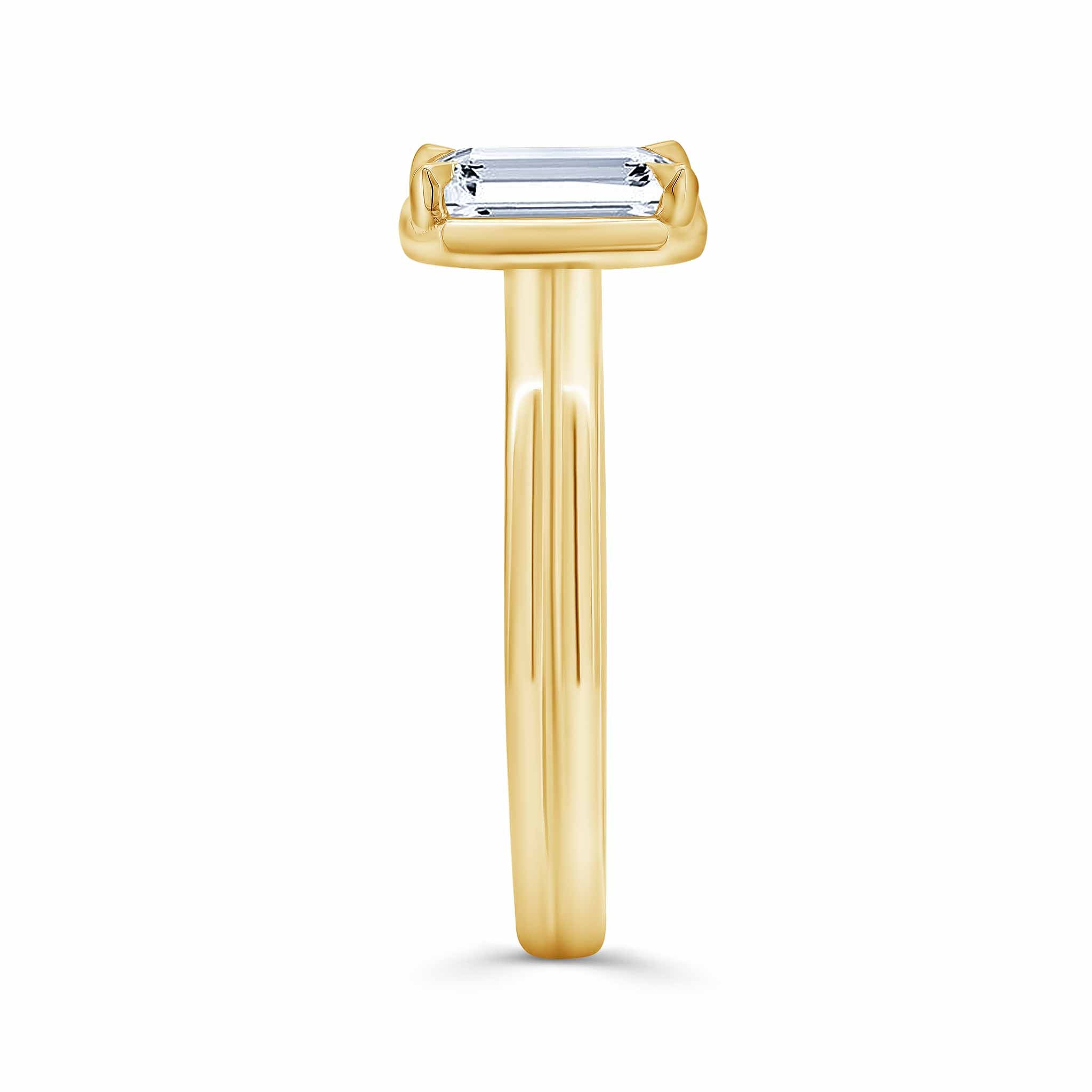 Double Band 2 Carat Emerald Cut Diamond Solitaire Ring in yellow gold showcasing modern elegance.
