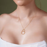 Vermeil Double Beaded Circle Necklace worn elegantly, featuring intertwined beaded circles on a delicate chain.