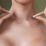 Model showcasing the Double Beaded Circle Necklace in silver, featuring intertwined beaded circles for a unique design.