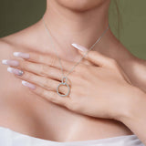 Model showcasing the Double Beaded Circle Necklace in silver, with beaded circles elegantly intertwined on a delicate chain.