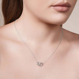 Gold Double Circle Necklace on model, showcasing intertwined circles and delicate design.