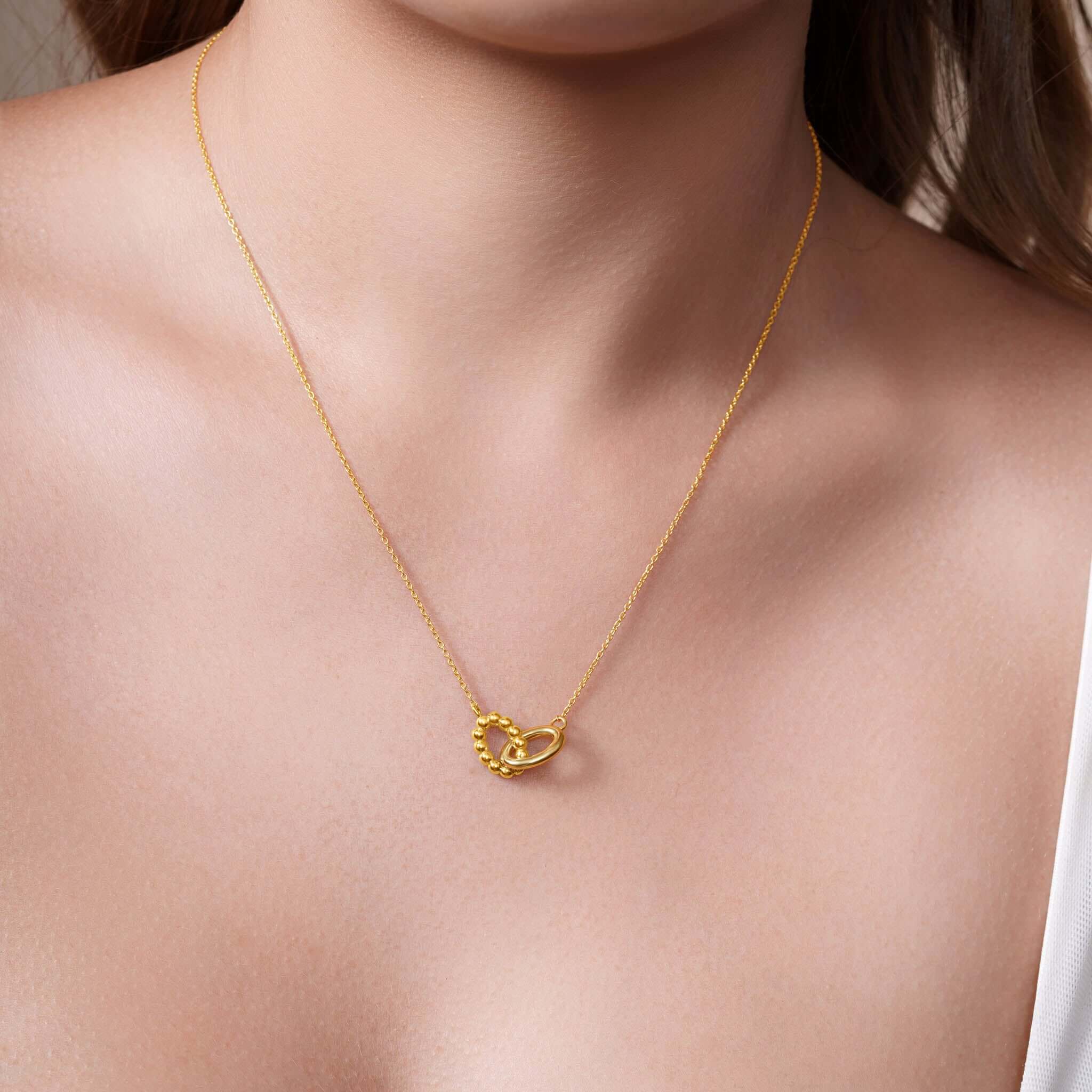 Vermeil Double Oval Necklace worn elegantly, showcasing intertwined polished and beaded ovals, perfect for any occasion.