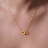 Vermeil Double Oval Necklace showcasing intertwined polished and beaded oval shapes for elegant style.