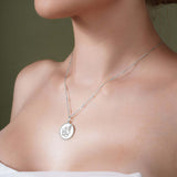 Zodiac Necklace featuring a medallion with a zodiac symbol on a sleek chain, adjustable length for a personalized style.