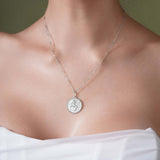Zodiac Necklace showcasing a zodiac symbol medallion on a sleek chain, perfect for layering or wearing close to the neckline.