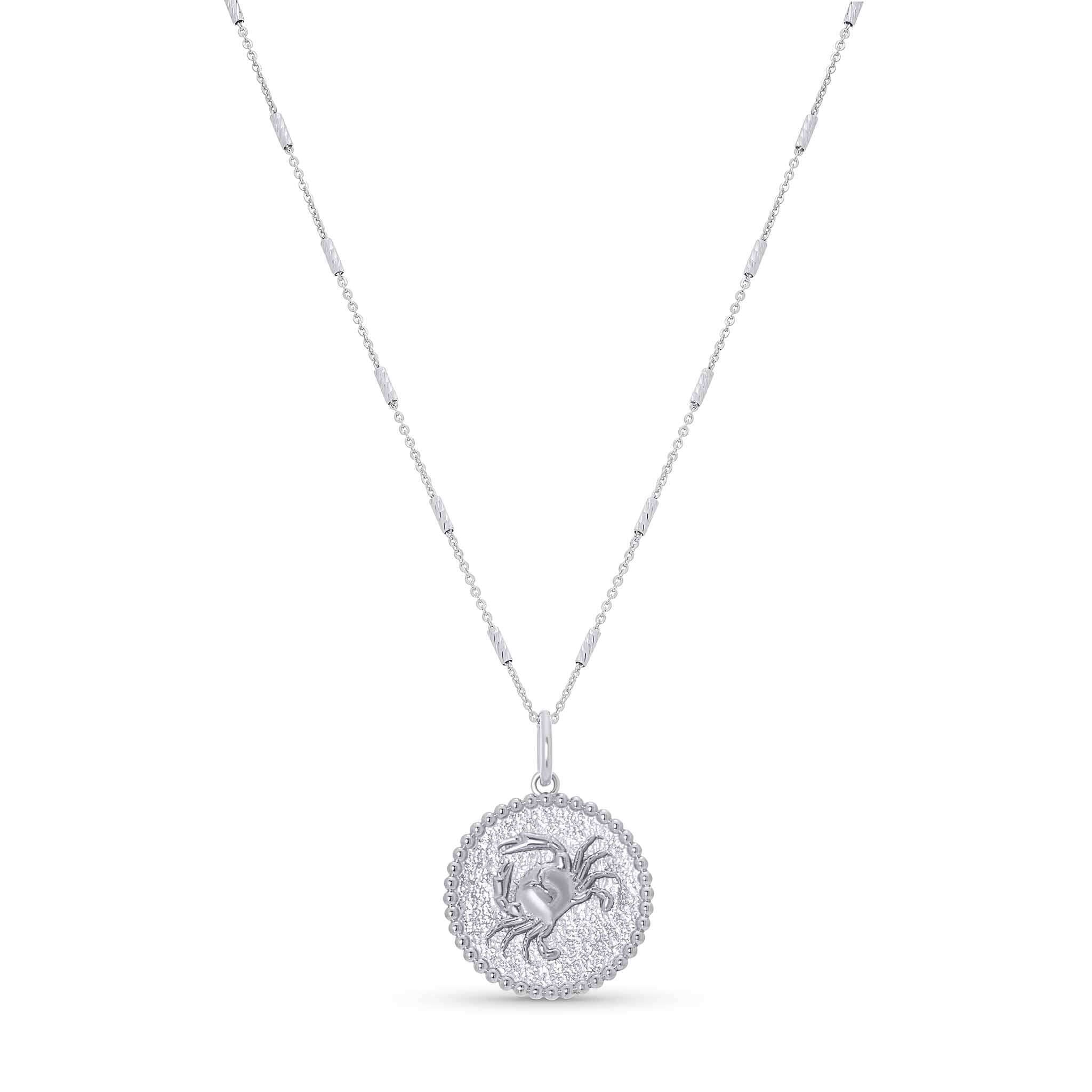 Zodiac Necklace showcasing a textured medallion design with a zodiac symbol, suspended from a sleek bar chain.