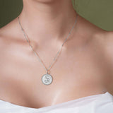 Zodiac Necklace featuring a medallion design showcasing the zodiac symbol on a sleek bar chain.