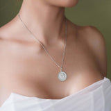Stylish model wearing a Zodiac Necklace with a zodiac symbol pendant on a sleek bar chain.