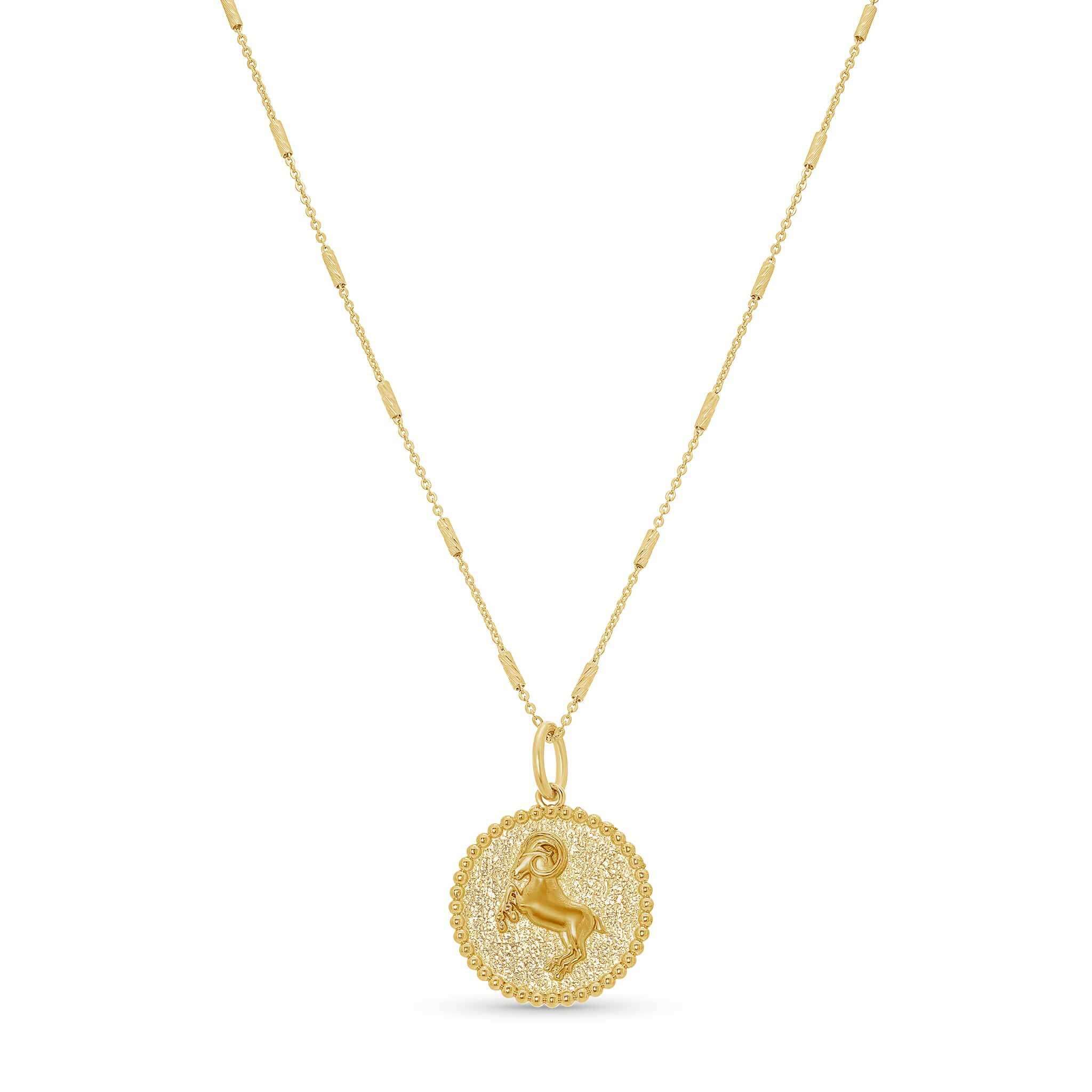 Zodiac Necklace featuring a gold medallion with zodiac symbol, set on a sleek chain, adjustable length.