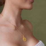 Zodiac Necklace featuring a gold medallion on a sleek chain, highlighting a zodiac symbol for personalized style.