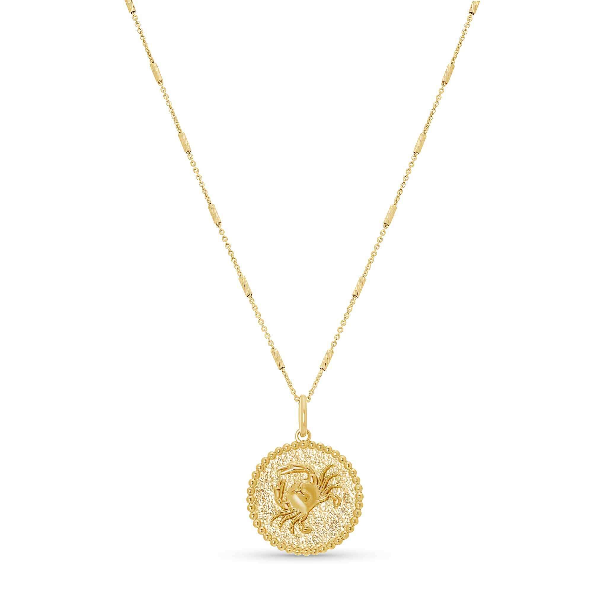 Zodiac Necklace featuring a gold medallion with zodiac symbol on a delicate chain, adjustable length.
