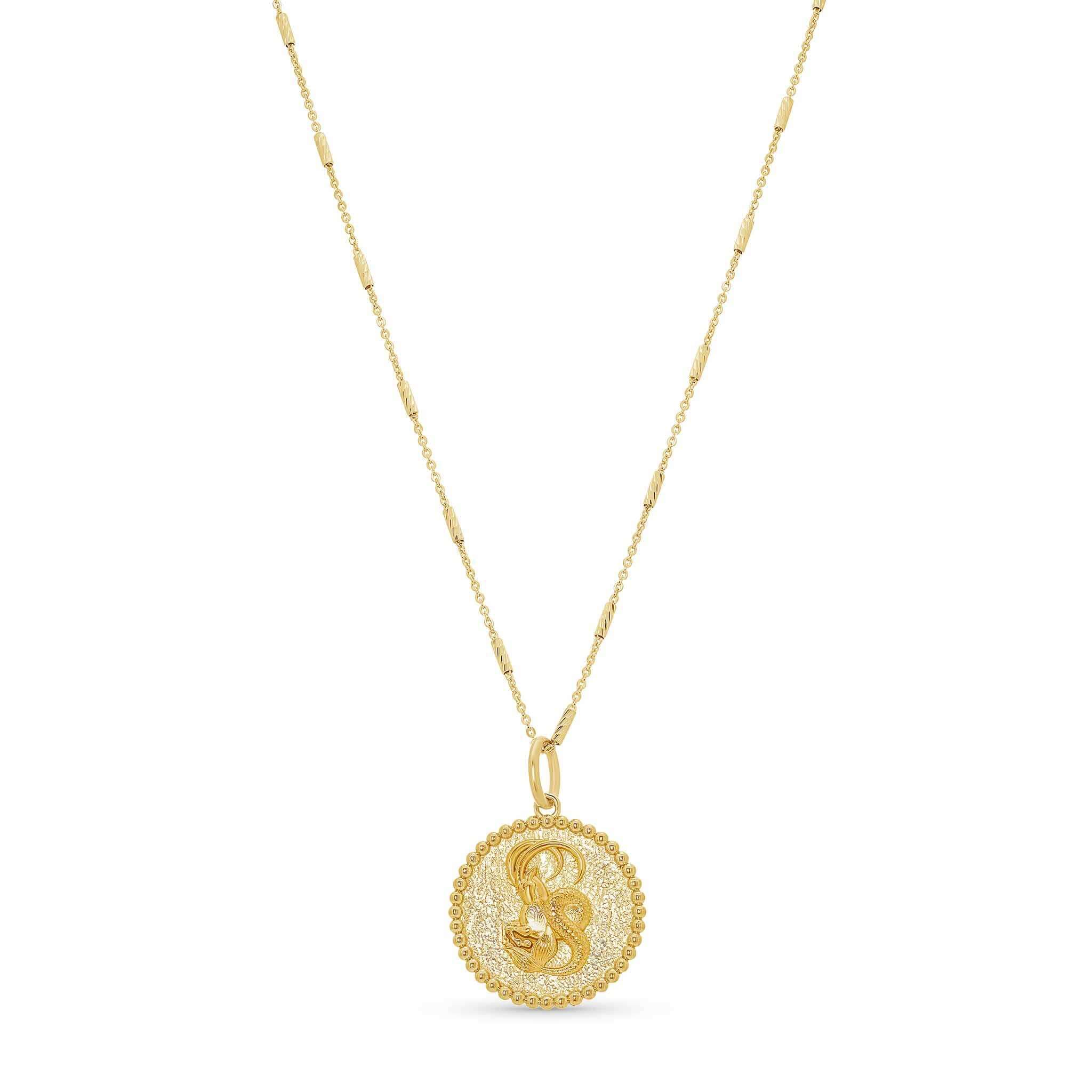Zodiac Necklace featuring a gold medallion with a zodiac symbol and a delicate bar chain.