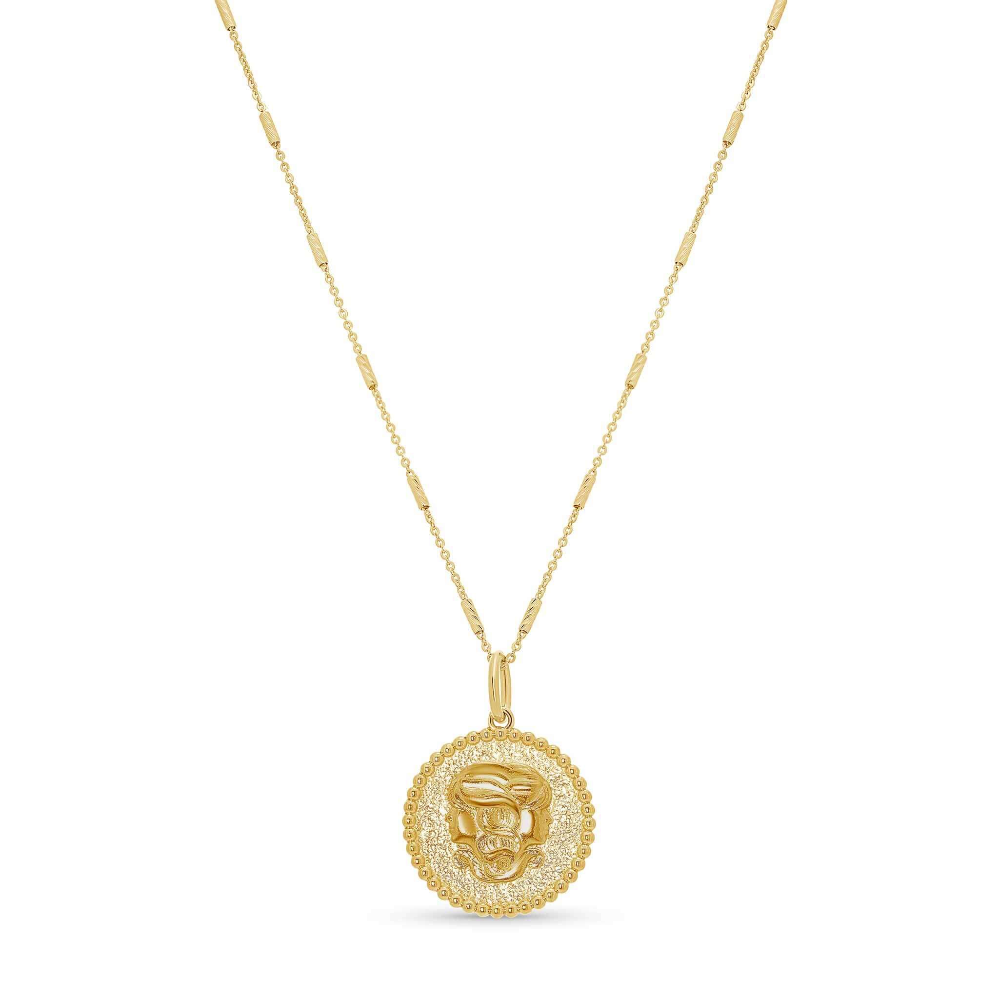 Zodiac Necklace featuring a textured medallion with a zodiac symbol, suspended from an adjustable chain.