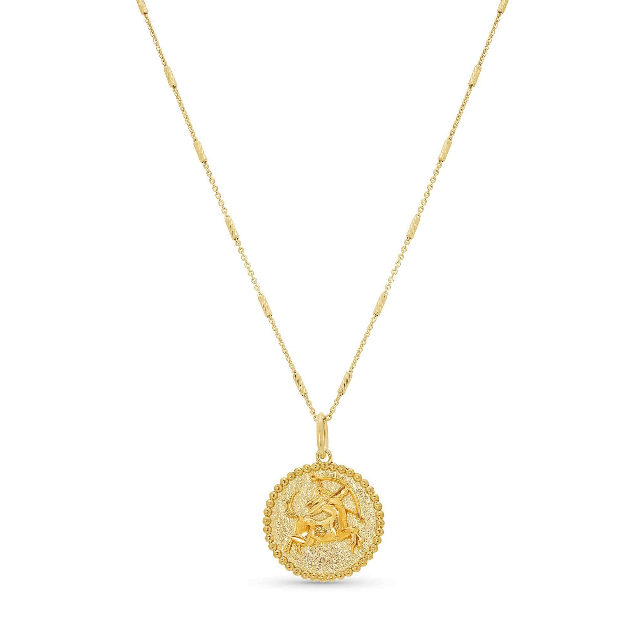 Elegant Zodiac Necklace with medallion showcasing zodiac symbol on textured background, suspended from sleek bar chain.
