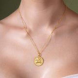 Zodiac Necklace featuring a gold medallion pendant with a zodiac symbol on a sleek chain, adjustable length.