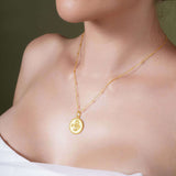 Zodiac Necklace worn by a model, featuring a gold medallion with zodiac symbol on a delicate chain.