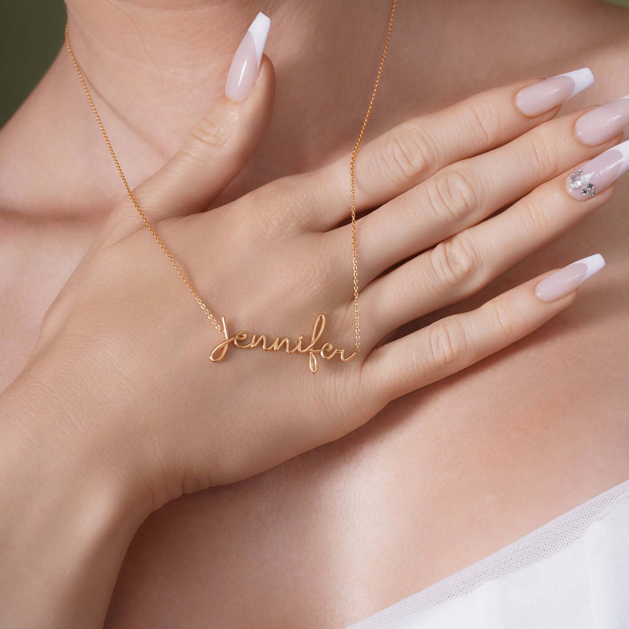 Gold Name Necklace featuring the name 'Jennifer' delicately crafted in 14k solid gold, showcased on a model.
