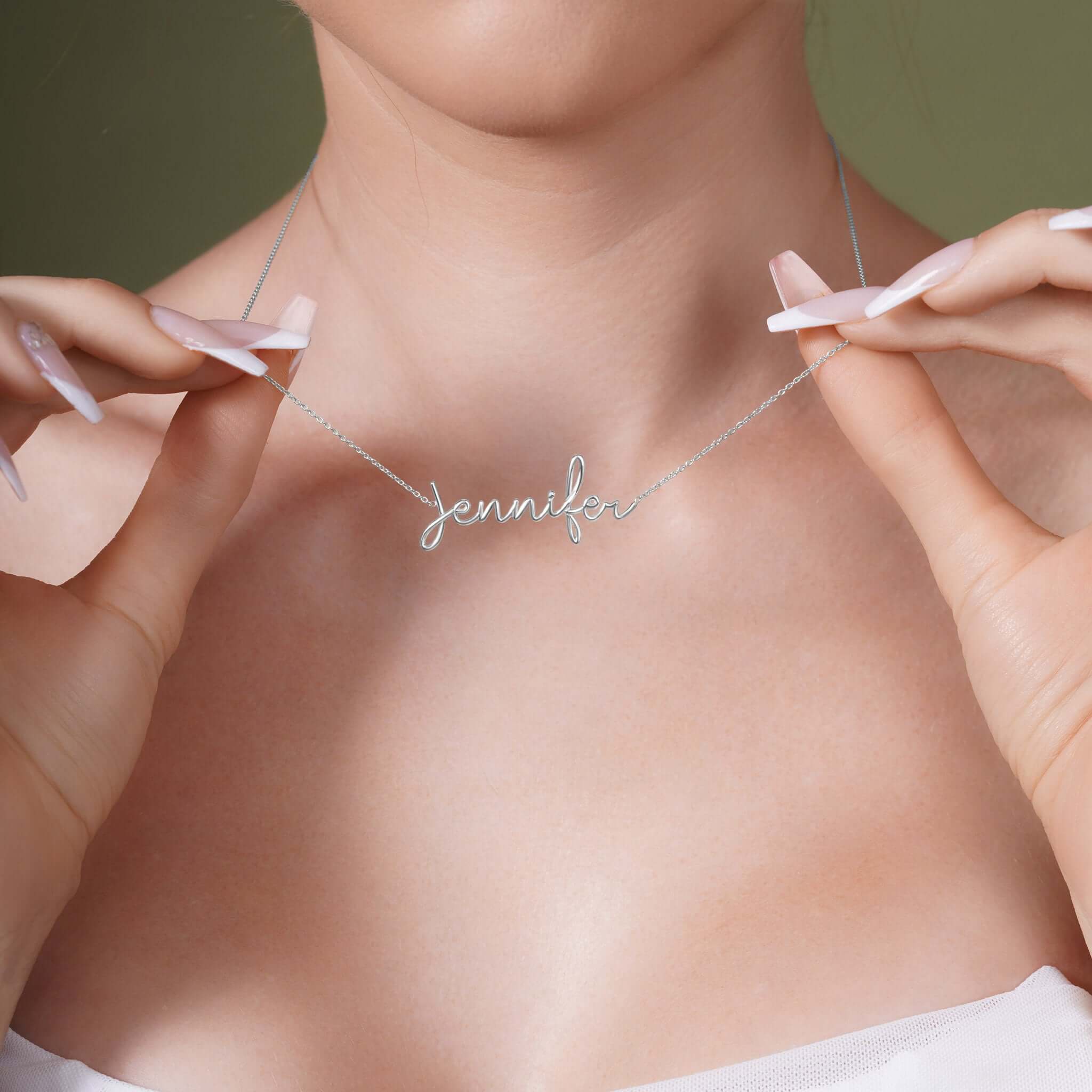 Woman wearing a Gold Name Necklace with the name 'Jennifer' in elegant script style.