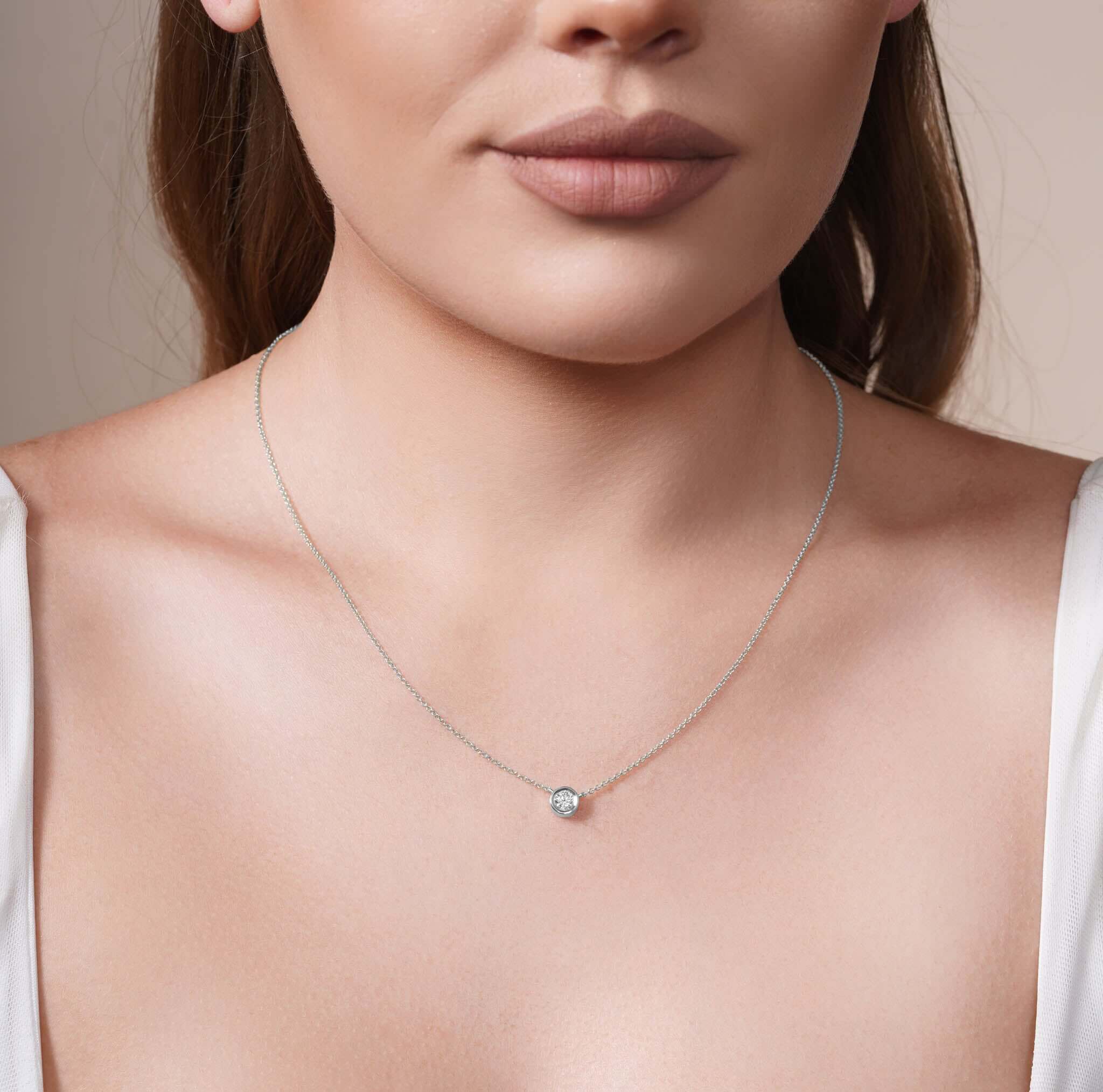 Half Carat Lab Diamond Necklace on a model, showcasing its brilliance and delicate chain design.