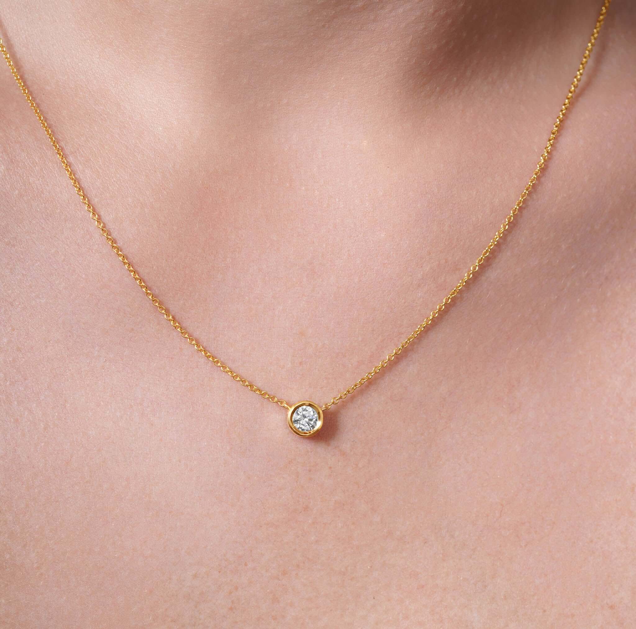 Half Carat Lab Diamond Necklace featuring a bezel-set lab-grown diamond on a delicate gold chain.