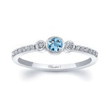 Mia Aquamarine three stone diamond promise ring featuring a central aquamarine and diamond accents.
