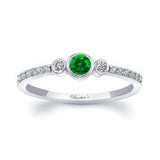 Mia Emerald three stone diamond promise ring featuring a vibrant emerald center and sparkling diamond accents.