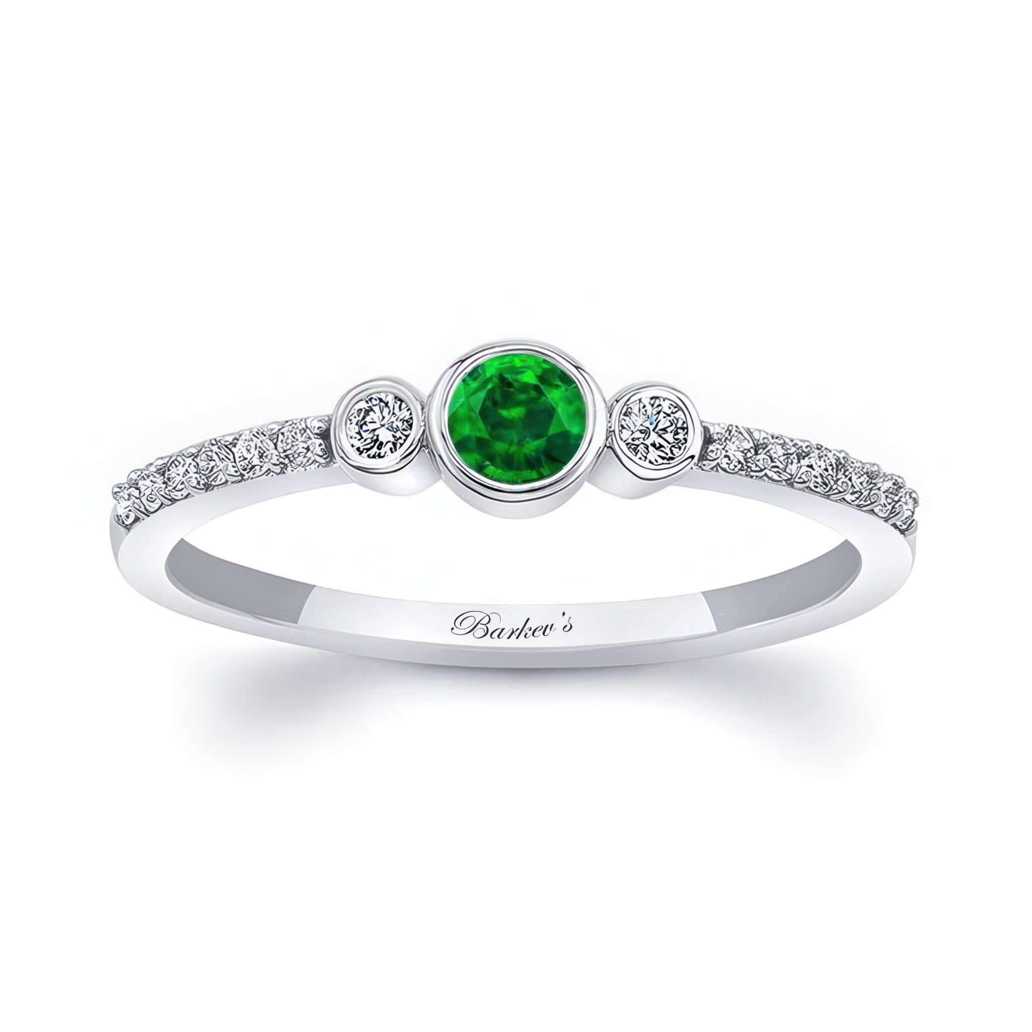 Mia Emerald three stone diamond promise ring featuring a vibrant emerald center and sparkling diamond accents.