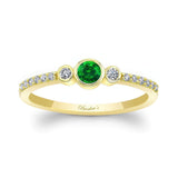 Mia Emerald three stone diamond promise ring featuring a vibrant emerald center and sparkling diamond accents.