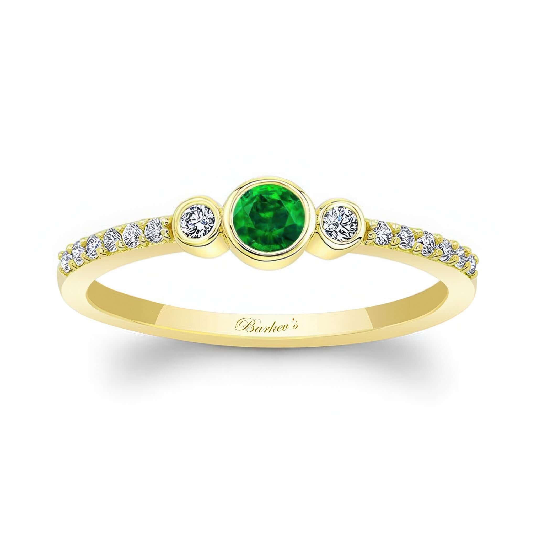 Mia Emerald three stone diamond promise ring featuring a vibrant emerald center and sparkling diamond accents.