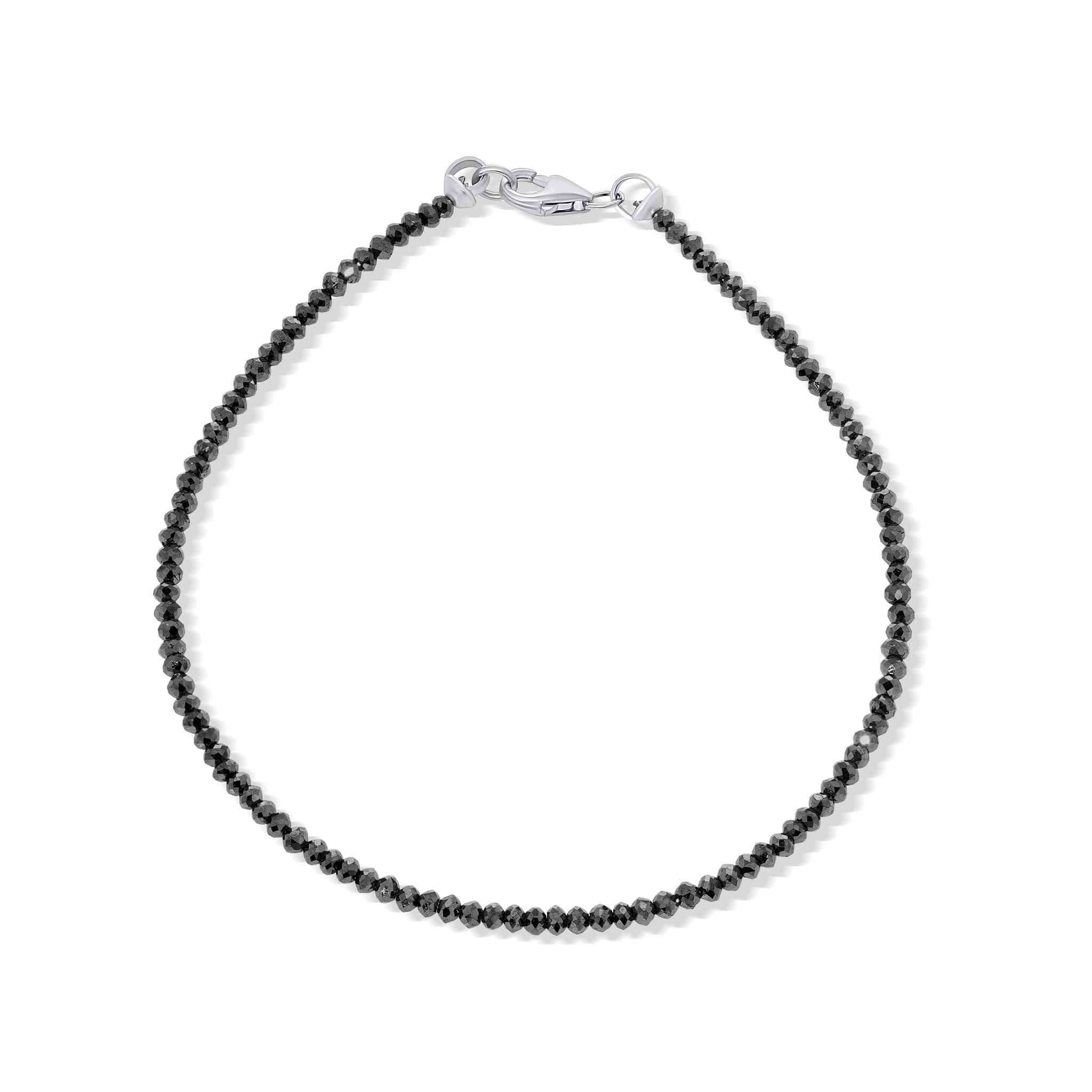 Black beaded bracelet with silver clasp on a white background